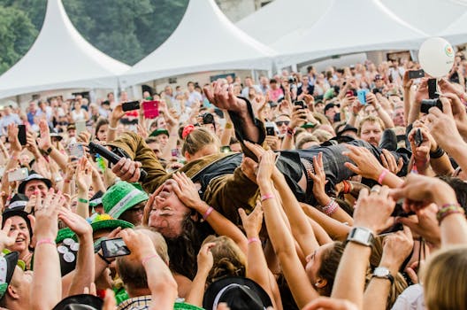 Diverse music festival crowd enjoying live performances