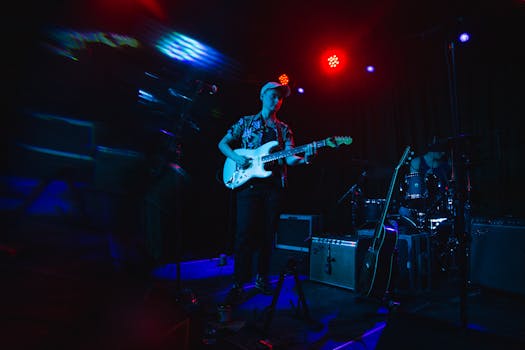 a musician performing on stage, connecting with the audience